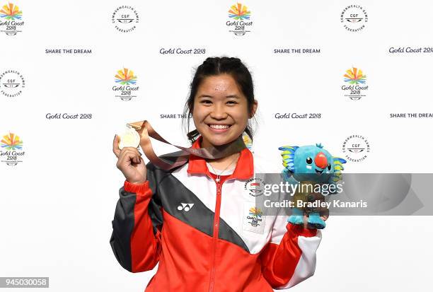 Martina Lindsay Veloso of Singapore celebrates winning a gold medal in the Women's 50m Rifle Prone event during Shooting on day eight of the Gold...