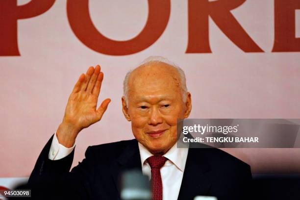 Singaporean Minister Mentor Lee Kuan Yew waves upon his arrival for a symposium in New Delhi on December 16, 2009. Lee is in India on a four-day...