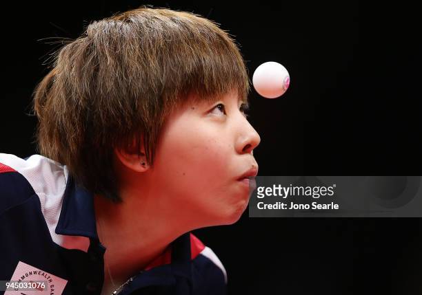 Yihan Zhou of Singapore competes in the women's doubles match with team mate Ye Lin against Miao Miao and Jian Fang Lay of Australia during Table...