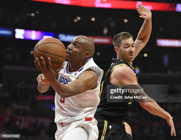 Williams of the LA Clippers gets past Travis Wear of the Los Angeles Lakers in the second half at Staples Center on April 11, 2018 in Los Angeles,...