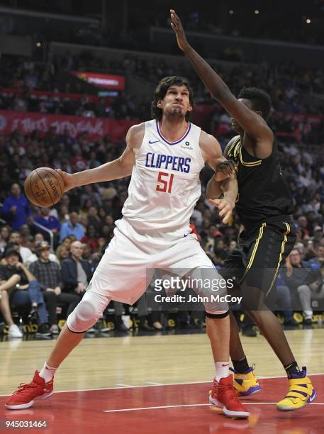 Boban Marjanovic of the LA Clippers goes up against Thomas Bryant of the Los Angeles Lakers in the second half at Staples Center on April 11, 2018 in...