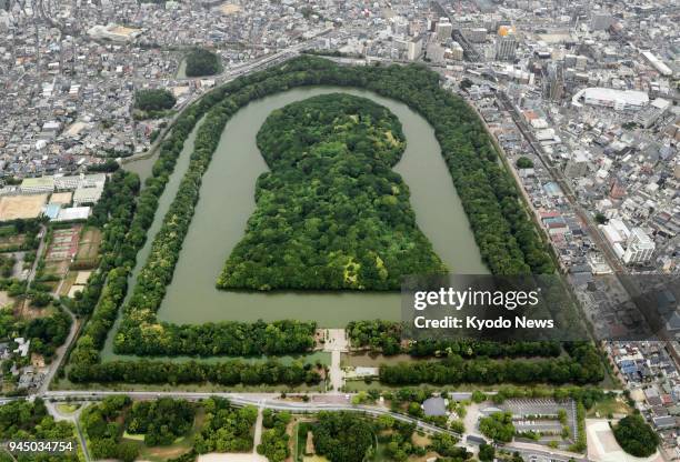 Photo taken in June 2017 shows Daisen Kofun, Japan's largest ancient mound, in Sakai in Osaka Prefecture, western Japan. The tomb, officially...