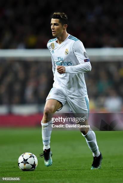 Cristiano Ronaldo of Real Madrid CF runs with the ball during the UEFA Champions League Quarter Final scond leg match between Real Madrid and...