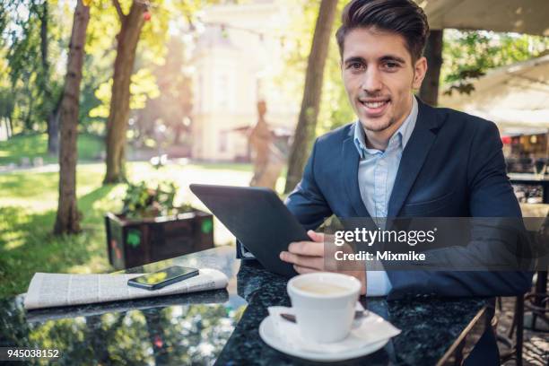 young business person looking at camera - 2017 common good forum stock pictures, royalty-free photos & images