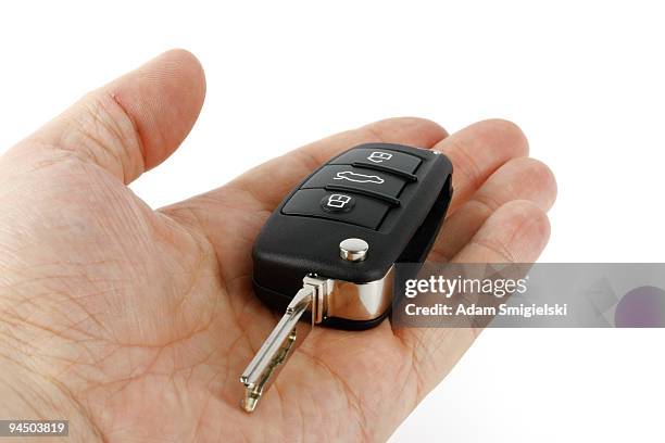 hand with car key - car keys on white stock pictures, royalty-free photos & images