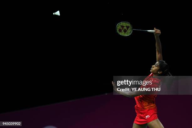 India's Venkata Pusarla hits a return against Australia's Hsuan-Yu Wendy Chen during their badminton women's singles round of 16 match at the 2018...