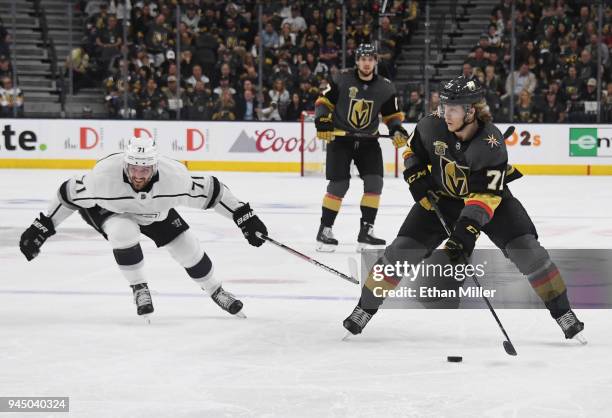 William Karlsson of the Vegas Golden Knights skates with the puck against Torrey Mitchell of the Los Angeles Kings in the second period of Game One...