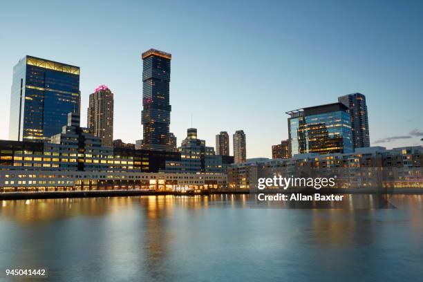 jersey city waterfront with the 'jersey city urby' skyscraper at dusk - newark new jersey stock pictures, royalty-free photos & images