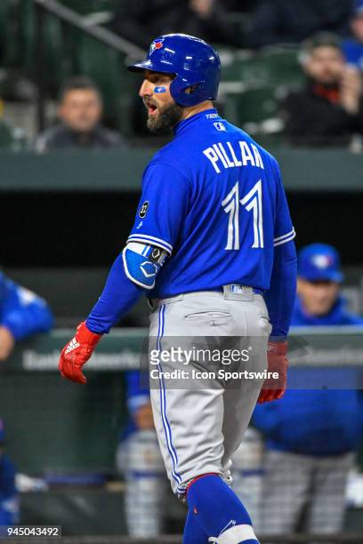 Toronto Blue Jays center fielder Kevin Pillar yells back the the home plate umpire after being called out on strikes in the eighth inning during the...