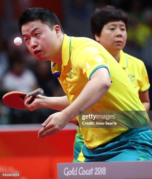 Xin Yan and Jian Fang Lay of Australia compete in the Mixed Doubles Round of 16 against Ning Gao and Mengyu Yu of Singapore during Table Tennis on...