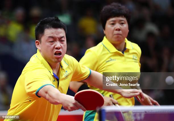 Xin Yan and Jian Fang Lay of Australia compete in the Mixed Doubles Round of 16 against Ning Gao and Mengyu Yu of Singapore during Table Tennis on...