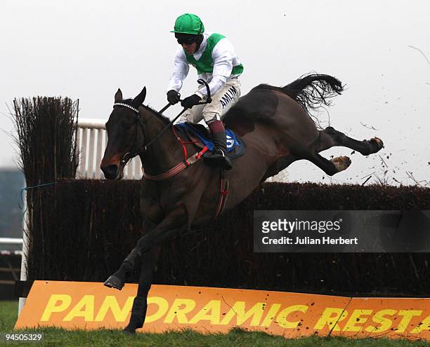 Richard Johnson and Fighting Chance clear the last fence before winning The Powersolve Electronics Greatwood Charity Handicap Steeple Chase Race run...