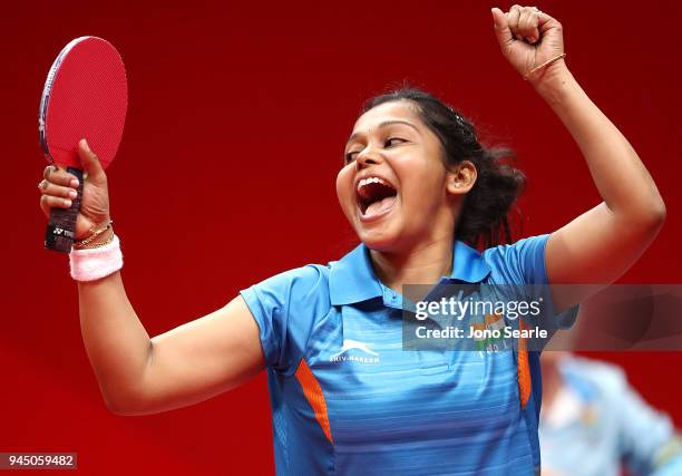 Mouma Das of India celebrates winning as she competes against Tin-Tin Ho of England in the women's singles round of 16 during Table Tennis on day...