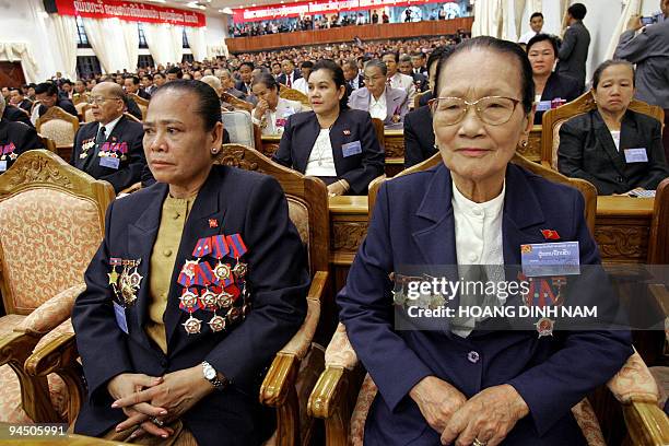 Women delegates listen to speeches during the opening ceremony of the Lao People's Revolutionary Party 's 8th five-yearly national congress in...