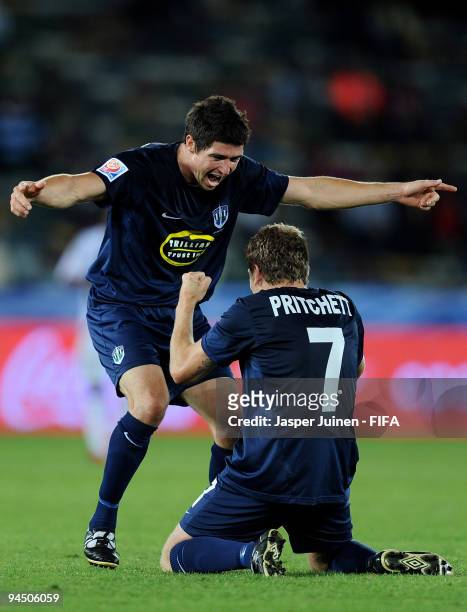 Matt Williams of Auckland City celebrates with teammate James Pritchett during the FIFA Club World Cup 5th place match between TP Mazembe and...