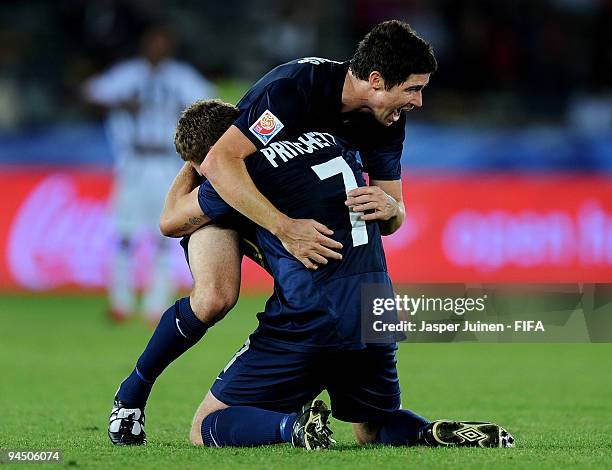 Matt Williams of Auckland City celebrates with teammate James Pritchett during the FIFA Club World Cup 5th place match between TP Mazembe and...