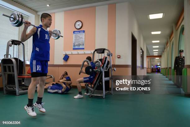 In a photo taken on April 10, 2018 a student exercises at a gym at the Mangyongdae Revolutionary Academy outside Pyongyang. The elite Academy was...