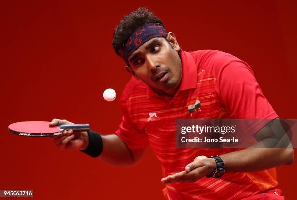 Sharath Achanta of India competes in the men's singles round of 16 match agasint Hemming Hu of Australia during Table Tennis on day eight of the Gold...