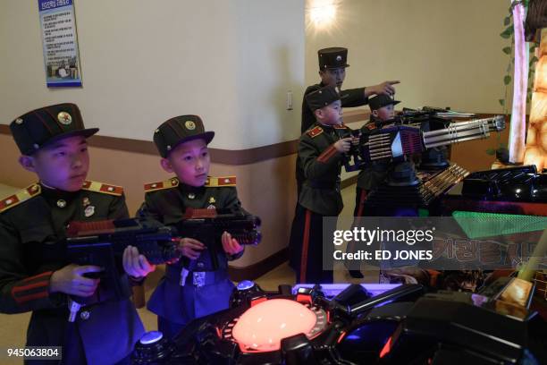 In a photo taken on April 10, 2018 students play computer games at the Mangyongdae Revolutionary Academy outside Pyongyang. The elite Academy was...