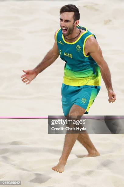 Damien Schumann of Australia celebrates winning the Beach Volleyball Men's Gold Medal match between Damien Schumann and Christopher Mchugh of...