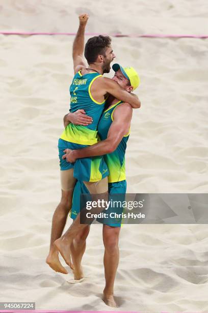 Christopher Mchugh of Australia and Sam Schachter celebrate winning the Beach Volleyball Men's Gold Medal match between Damien Schumann and...