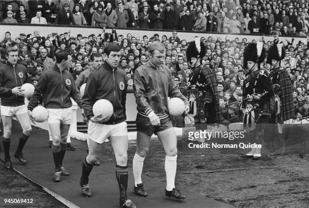 English soccer player Bobby Moore and Scottish soccer player John Greig lead out their teams prior kick-off of England vs Scotland game, UK, 24th...