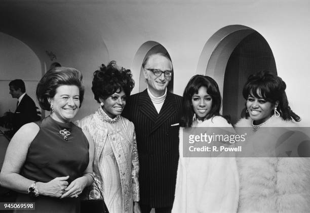 American female singing group The Supremes with Ian Russell, 13th Duke of Bedford and his wife Nicole Russell, Duchess of Bedford at a party, UK,...