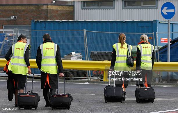 EasyJet cabin crew leave after a flight at Gatwick airport in Crawley, U.K., on Wednesday, Dec. 16, 2009. EasyJet Plc, Europe's second-biggest...