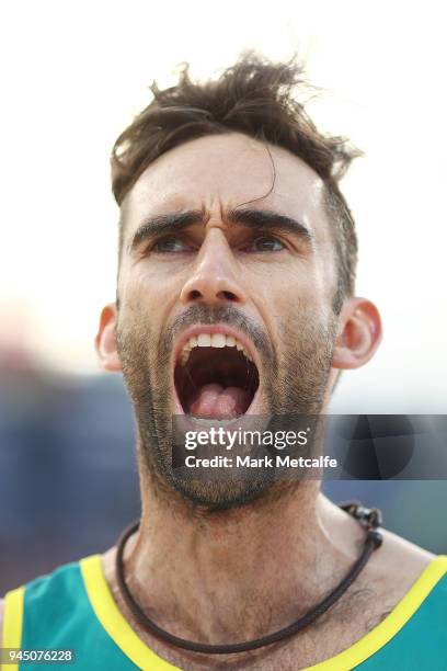 Damien Schumann of Australia celebrates winning set point during the Beach Volleyball Men's Gold Medal match between Damien Schumann and Christopher...