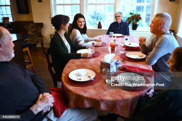 The three generations enjoy nightly meals around the dining room table March 22, 2018 in Arlington, VA. Clockwise from left are Jim Gibbs, Lisa...