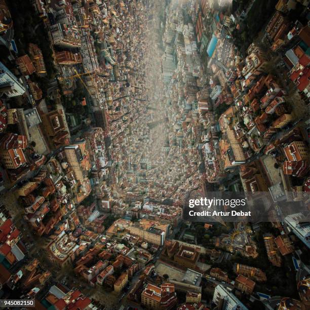 creative picture bending the cityscape of barcelona in a surreal picture of architecture taken from above. - city from a new angle stockfoto's en -beelden