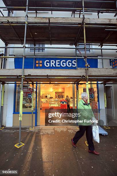 Greggs, the bakers, the first flooded damaged shop to open on Cockermouth High Street helps feed the army of construction workers on December 16,...