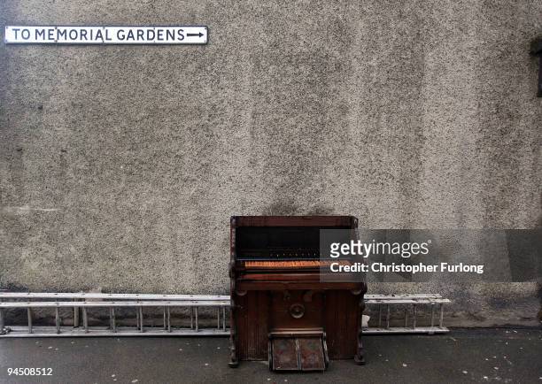 Flood damaged piano sits in a street in Cockermouth on December 16, 2009 in Cockermouth, England. An army of contractors and utility workers are...