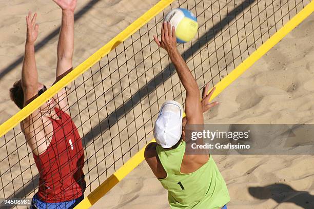 beachvolley two players duel at the net - beach volley stockfoto's en -beelden