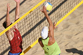Beachvolley two players duel at the net