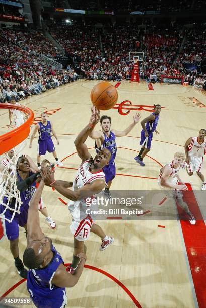 Carl Landry of the Houston Rockets puts up a shot against Kenny Thomas of the Sacramento Kings during the game on November 21, 2009 at the Toyota...