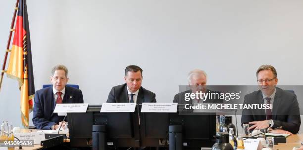 German Interior Minister Horst Seehofer sits next to the president of the German Federal Criminal Police Office Holger Muench , the head of the...