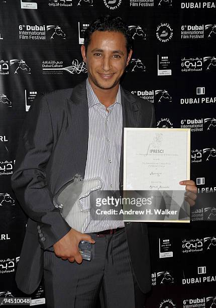 Actor Nabil Asli with the Muhr Arab Special Jury Prize for Harragas and the Fiprisci Prize during the Closing Night Award Ceremony at the 6th Annual...