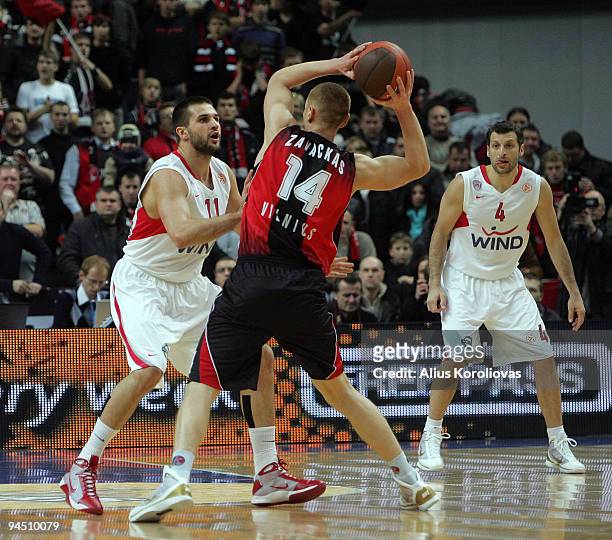 Linas Kleiza, #11 of Olympiacos Piraeus competes with Donatas Zavackas, #14 of Lietuvos Rytas during the Euroleague Basketball Regular Season...