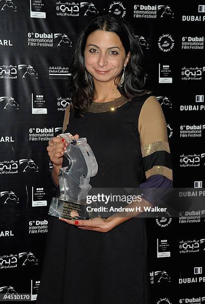 Zeina Daccache with the Muhr Arab Documentary First Prize award for 12 Angry Lebanese and the Peoples Choice award during the Closing Night Award...