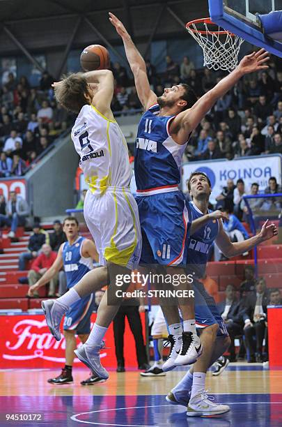 Fenerbahce's Erden Semih vies with Cibona's Vuksic Vedran and Andric Luksa during their Euroleague basketball match in Zagreb, Croatia on December...