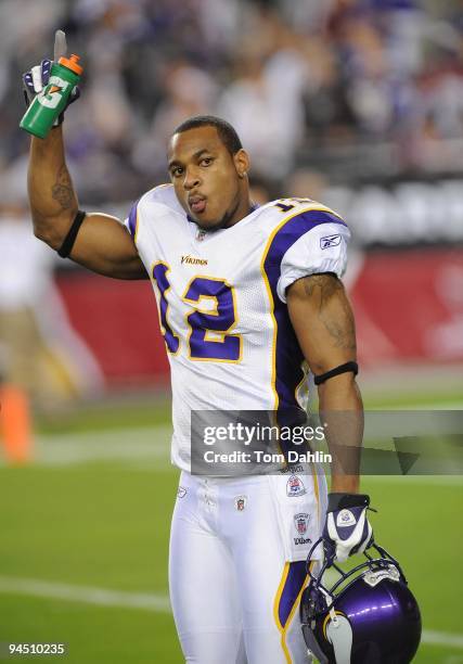 Percy Harvin of the Minnesota Vikings waves to fans during the NFL game against the Arizona Cardinals at the Universtity of Phoenix Stadium on...