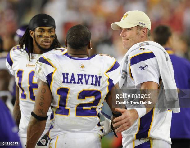 Brett Favre and Percy Harvin of the Minnesota Vikings talk on the sidelinesl during the NFL game against the Arizona Cardinals at the Universtity of...