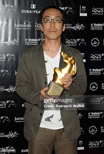 Tokachi Tsuchiya with the Muhr AsiaAfrica Documentary First Prize award for "A Normal Life, Please" during the Closing Night Award Ceremony at the...