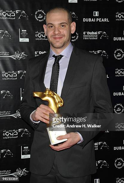 Bassam Ali Jarbawi with the Muhr Arab First Prize award for Short Film during the Closing Night Award Ceremony at the 6th Annual Dubai International...