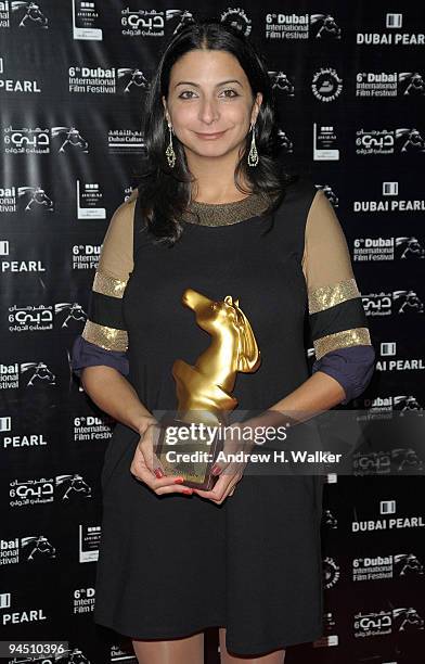 Zeina Daccache with the Muhr Arab Documentary First Prize award for 12 Angry Lebanese and the Peoples Choice award during the Closing Night Award...