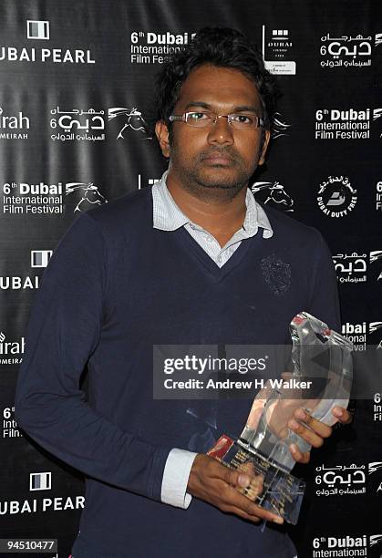 Director Vimukthi Jayasundara with the Muhr AsiaAfrica Feature award for Best Cinematographer on behalf of Channa Deshapriya during the Closing Night...