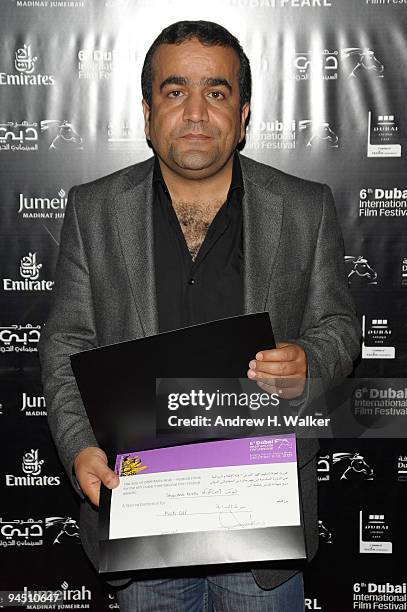 Shawkat Amin Korki with the Muhr Arab Feature Special Mention award for "Kick Off" during the Closing Night Award Ceremony at the 6th Annual Dubai...