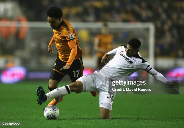 Helder Costa of Wolverhampton Wanderers is tackled by Curtis Davies during the Sky Bet Championship match between Wolverhampton Wanderers and Derby...