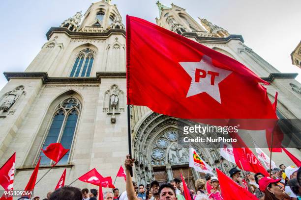 Supporters of Brazilian former president Luiz Inacio Lula da Silva hold a demonstration outside of Se Cathedral in Sao Paulo, Brazil on April 11,...